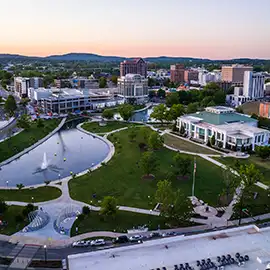 Aerial view of Big Spring Park and downtown Huntsville skyline at dusk