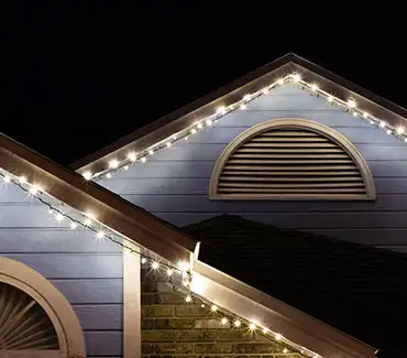 Traditional-style home with permanent outdoor LED lighting along the roofline